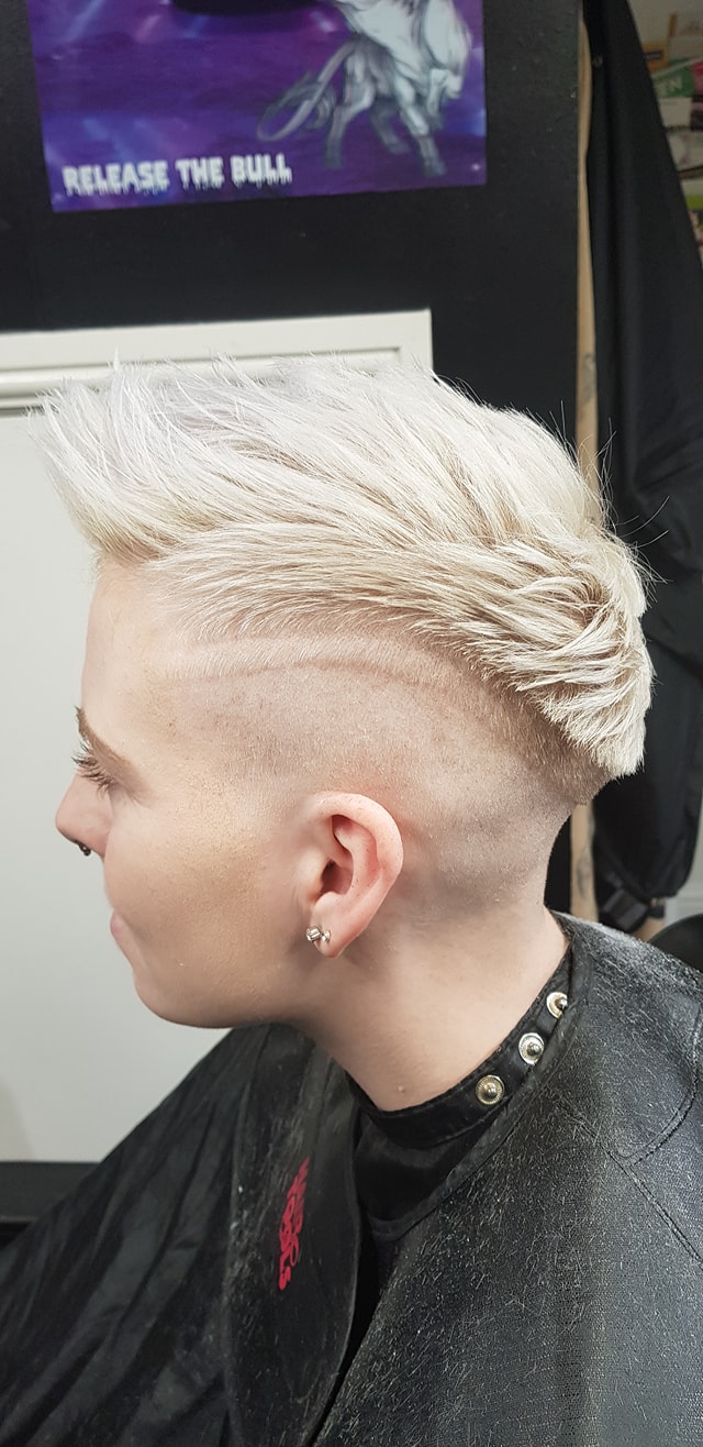 A close view of a finished textured short hairstyle, showing the detail of the cut